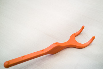 Closeup of floss stick for dental hygiene