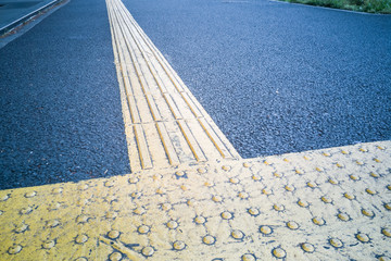 Outdoor pedestrian tactile facility for visually impaired people