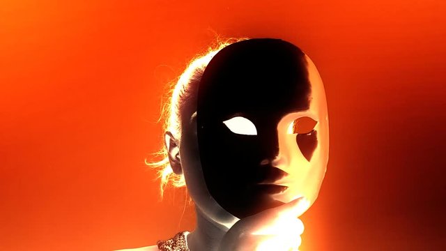 A cute girl hides a half of her face behind a plain mask, seen from the unusual point of view of a monster (a zombie or a vampire), glowing vivid colors.
