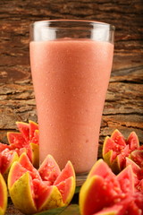 Glass of cold pink guava fruit smoothie 