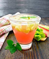 Lemonade with rhubarb and mint on table
