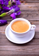 cup of fragrant black coffee on a gray table