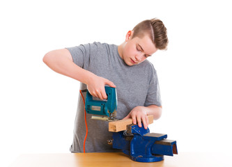 teenager in professional training using padsaw