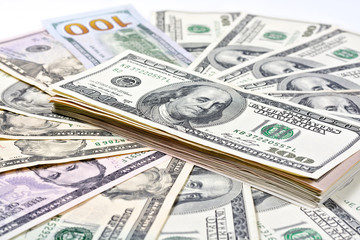 A stack of banknotes on a background of dollars 
