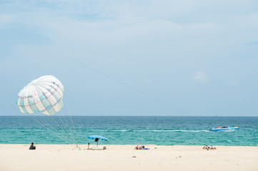 Parasailing on the beach in Karon beach Phuket Thailand, Phuket Beach Sports and Activities. Summer holiday vacation and exotic leisure experience concept. - 149562692
