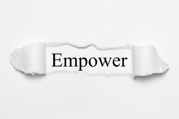 Empower on white torn paper