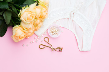 modern romance; Fashion accessories on pink background. flat lay