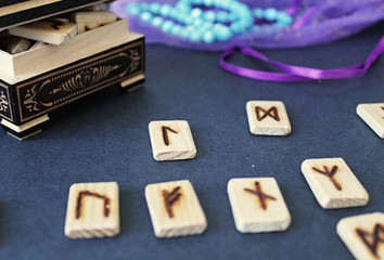 Fototapeta premium Wooden runes in casket