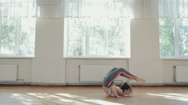 Woman dancer make acrobatic trick