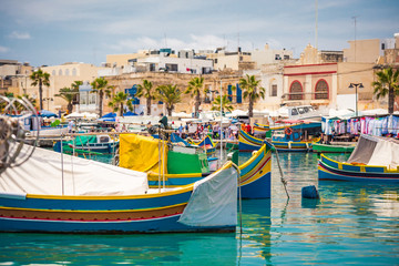 Fototapeta na wymiar colorful fishing boat in the bay near Marsaxlokk in Malta