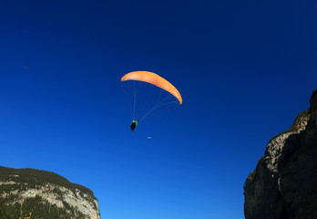 Fototapeta na wymiar Paragliding in the Swiss Alps, Lauterbrunnen Valley, Europe