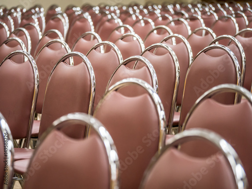 "Beautiful group of chairs in big hall, abstract row of chairs layout