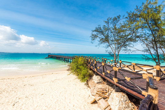 beautiful landscape with wooden stage leading to the clear blue ocean, Africa