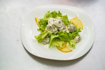 Vegetable salad with liver in cream