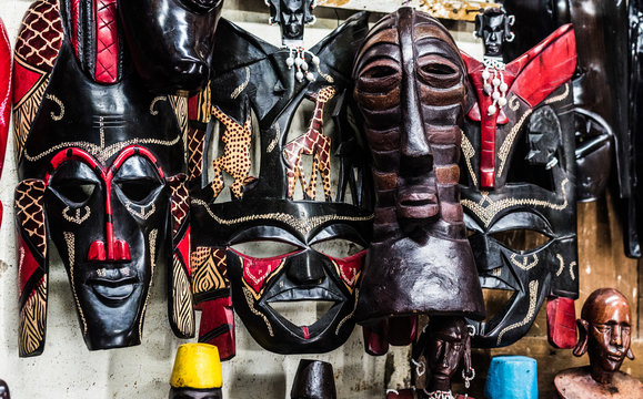 variety of african tribal handmade masks at souvenir market