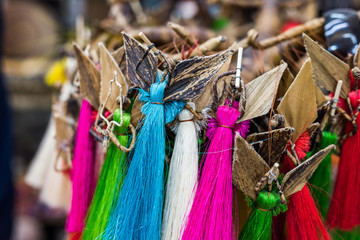 colorful simple dolls of threads on local african souvenir market