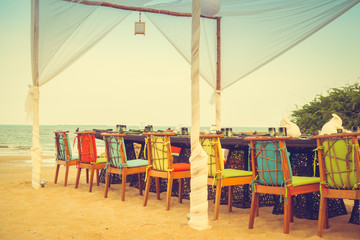 Table and chair set on the beach for dinner
