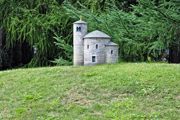 Cylindrical shape stone building with cross