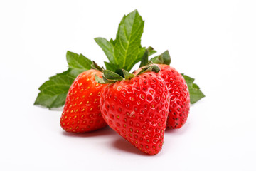 Red berry strawberry isolated on white background. Strawberries with leaves. Isolated on a white background.