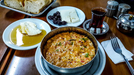 Turkish Breakfast menemen with tea .