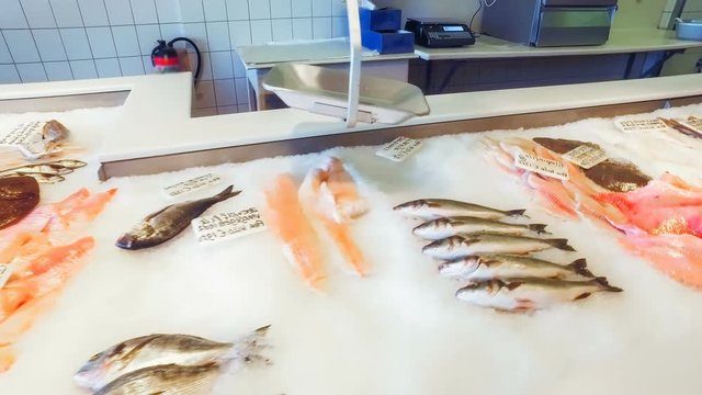 Fresh fish on ice at market counter. Food and drink background