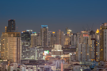 Fototapeta na wymiar Cityscape with light show from building of Bangkok