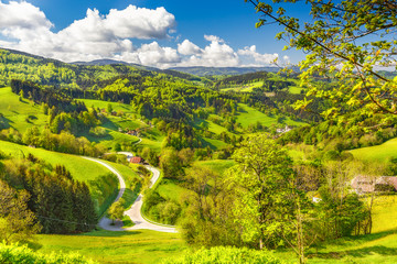 Scenic panoramic landscape of a picturesque mountain valley in spring. Scenic historic village with...