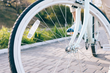 Close-up of vintage Bicycle wheels with white tires and reflector