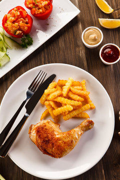 Roast chicken leg with french fries - restaurant