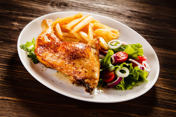 Roast chicken leg with french fries