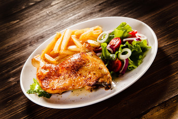 Roast chicken leg with french fries