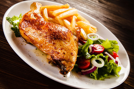 Roast chicken leg with french fries