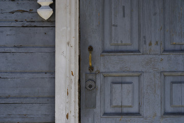 Old rusty door handle in classic facade