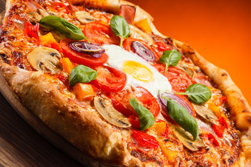 Pizza with egg and mushrooms