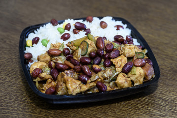 Delicious Chinese food with rice, beans and meat