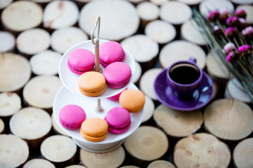macaroons, cup of coffee and dried flowers