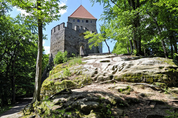 Stone wall and monumental tower on the rock