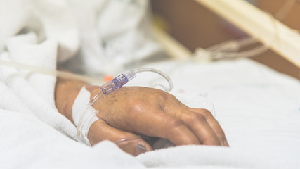 Obraz na płótnie Canvas Patient in the hospital with saline intravenous