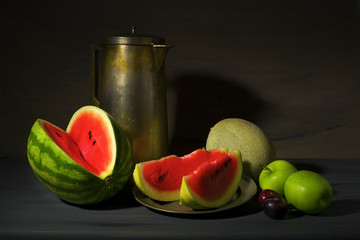 vintage style food still life with watermelons and other fruit