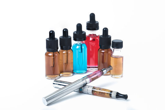 Two electronic cigarettes with glass e-liquid bottles on white background