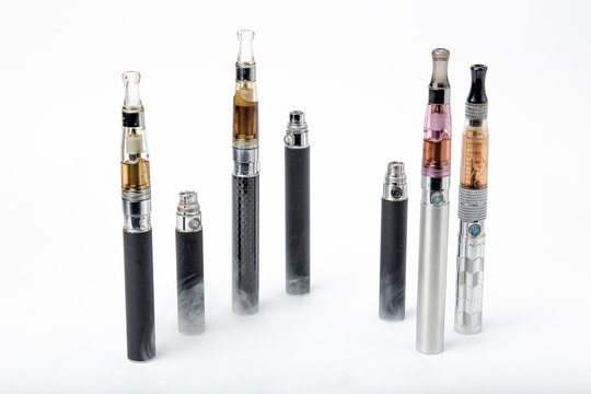 Electronic cigarettes with smoke on white background