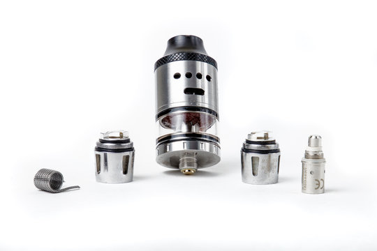 Electronic cigarette tank and coils on white background