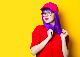 young woman in cap and glasses