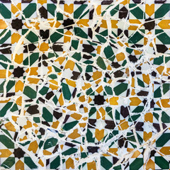 Broken glass mosaic tile, decoration in Park Guell, Barcelona, Spain. Designed by Gaudi
