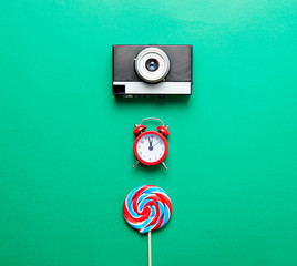 lollipop, alarm clock and camera