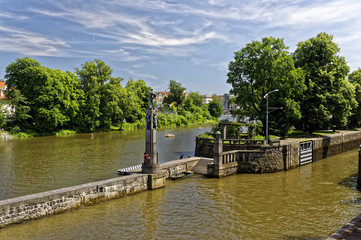 Fototapeta premium Wall is constructed to separate the river and the canal