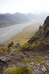 Hiking to the glacier. Tough, cold and wet weather. Wind, a lot of rain. View over mountain range....