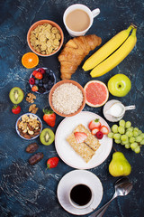 Breakfast with pancakes, fruits, nuts, coffee