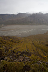 Hiking to the glacier. Tough, cold and wet weather. Wind, a lot of rain. View over mountain range....