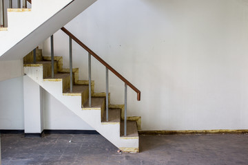 Photograph of old stair way in abandoned house.